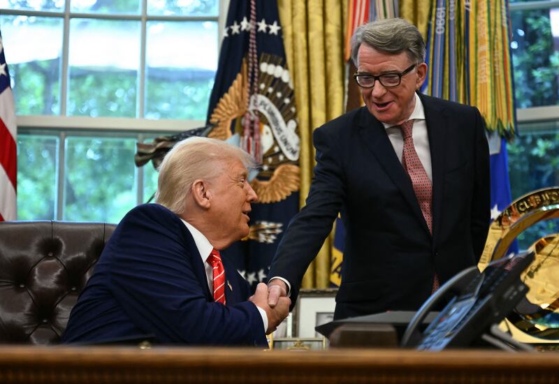 US President Donald Trump shakes hands with British ambassador to the United States Peter Mandelson  after making a trade announcement in the Oval Office of the White House in Washington, DC, on May 8, 2025.