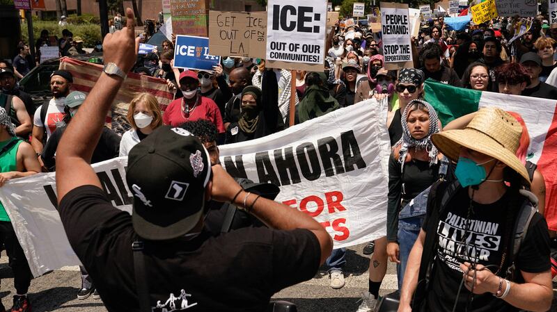 People attend a rally in downtown Los Angeles, California, U.S. June 9, 2025.