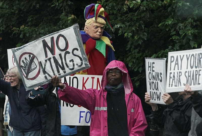 Demonstrators gather outside Trump National Golf Course ahead of U.S. President Donald Trump’s meme coin gala in Sterling, Virginia