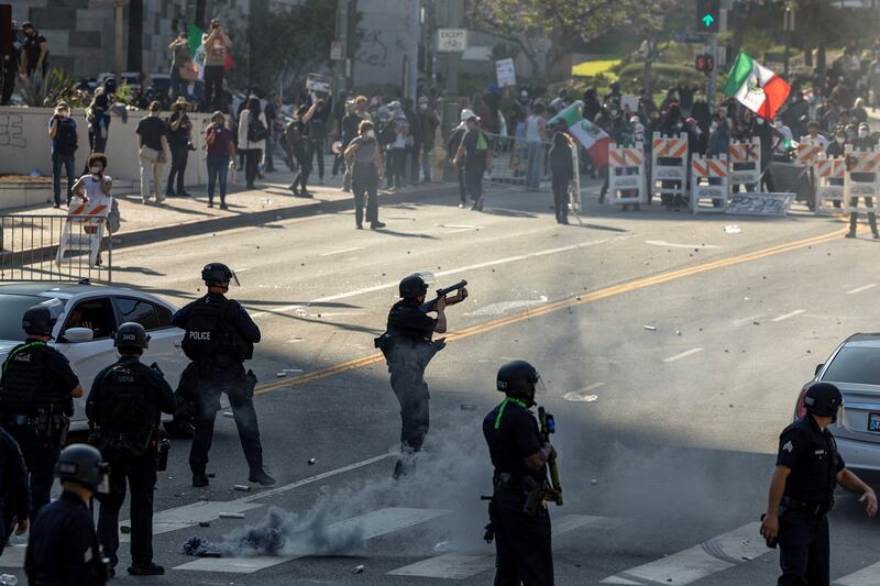 Protesters clash with law enforcement in the streets surrounding the federal building during a protest following federal immigration operations in Los Angeles, California, on June 8.