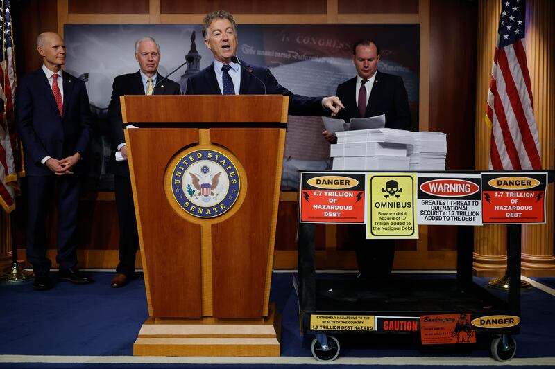 Republican Sen. Rand Paul, of Kentucky, is flanked by his fellow budget hawks Sen. Rick Scott (R-FL), Sen. Ron Johnson (R-WI), and Sen. Mike Lee (R-UT) at the U.S. Capitol on December 20, 2022.