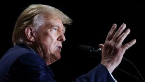 Donald Trump speaks with his hand up during a campaign event.