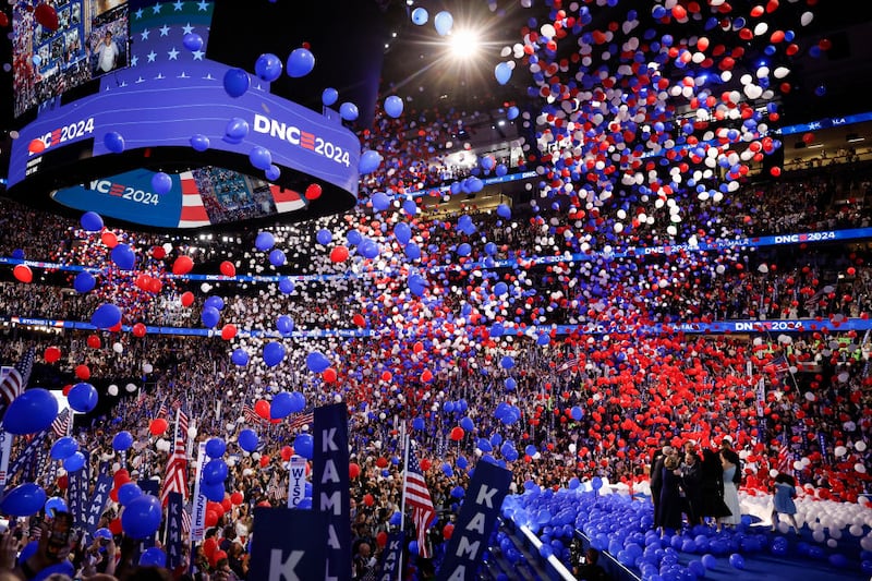 Balloons fall as Democratic presidential nominee, U.S. Vice President Kamala Harris, celebrates with her family during the final day of the Democratic National Convention.