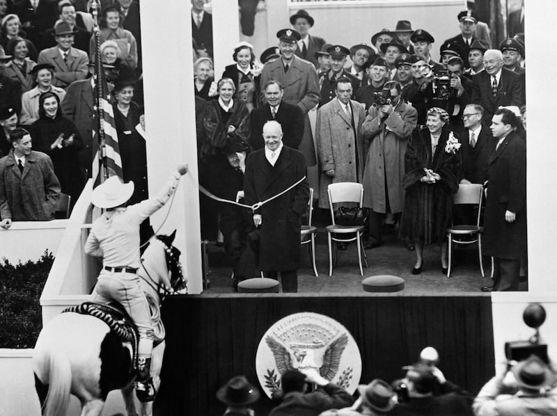 US President Dwight D. Eisenhower is caught by a lasso during the parade of the 34th Presidential Inauguration ceremonial swearing-in at the US Capitol.