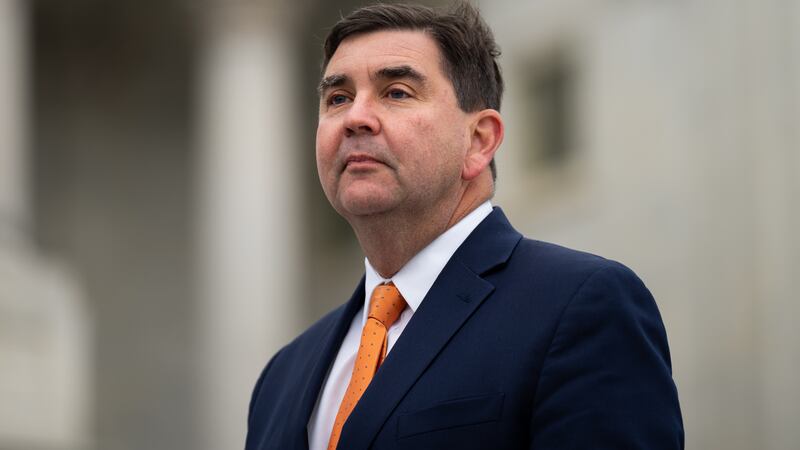 John Mannion poses for a photo on the the House steps of the Capitol.