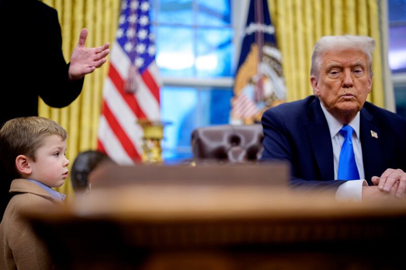 Elon Musk and son X in the Oval Office.