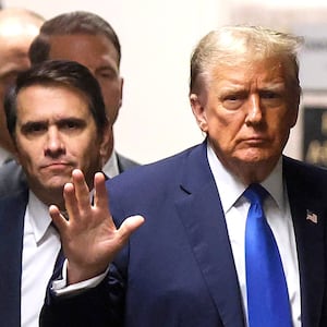 NEW YORK, NEW YORK - APRIL 18: Former U.S. President Donald Trump waves as he returns to the courtroom with attorney Todd Blanche during a recess in his criminal trial as jury selection continues at Manhattan Criminal Court on April 18, 2024 in New York City. Trump was charged with 34 counts of falsifying business records last year, which prosecutors say was an effort to hide a potential sex scandal, both before and after the 2016 presidential election. Trump is the first former U.S. president to face trial on criminal charges. (Photo by Brendan McDermid-Pool/Getty Images)