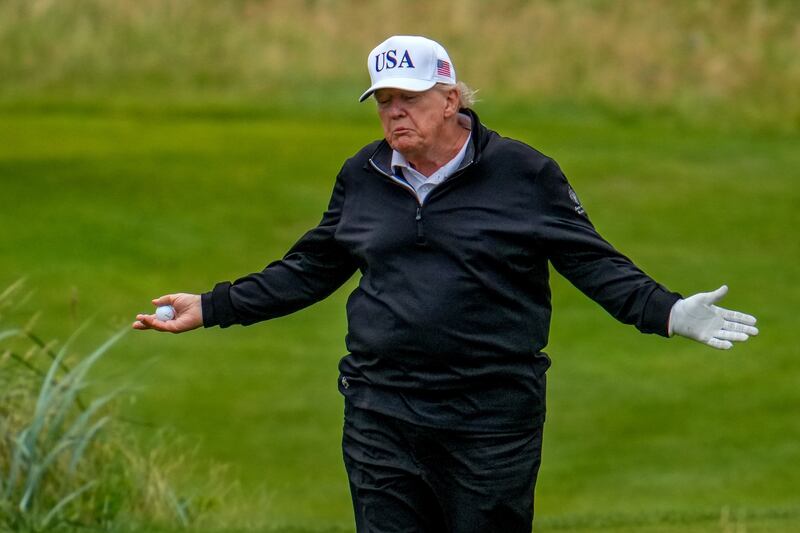 President Donald Trump reacts as he plays a round of golf at Trump Turnberry golf course during his visit to the UK on July 27, 2025 in Turnberry, Scotland.