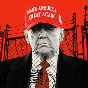 Donald Trump in a MAGA hat on a red background in front a chain fence in Guantanamo Bay