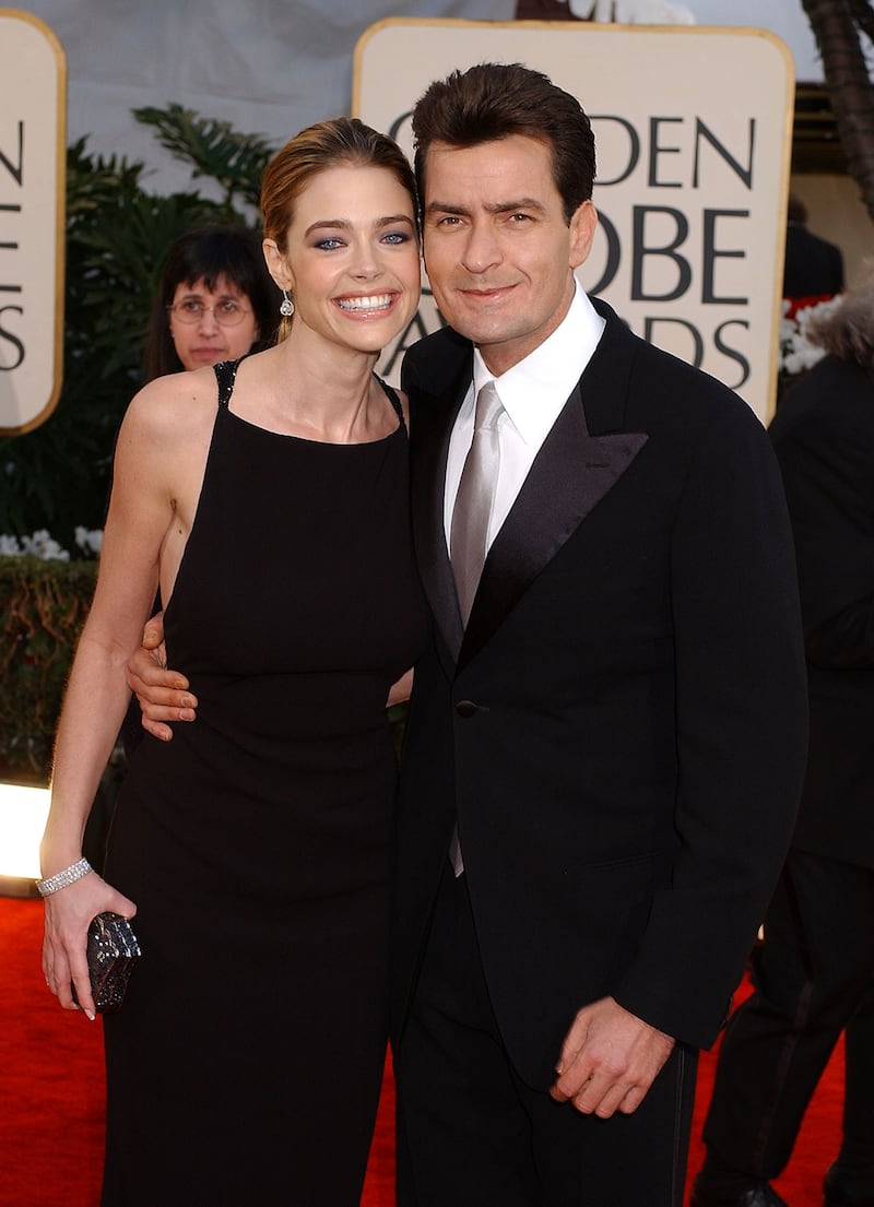 Denise Richards and Charlie Sheen arrive at the Golden Globe Awards at the Beverly Hilton January 20, 2002 in Beverly Hills, California.