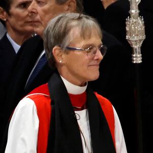 Bishop Mariann Edgar Budde (L) arrives as U.S. President Donald Trump looks on during the National Prayer Service at Washington National Cathedral on January 21, 2025 in Washington, DC.