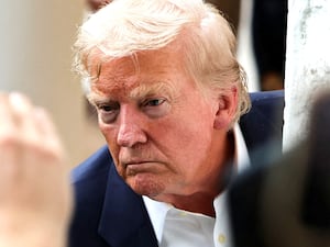 U.S. President Donald Trump looks at media members after returning to the White House from Scotland, Britain, in Washington, D.C., U.S., July 29, 2025. REUTERS/Umit Bektas