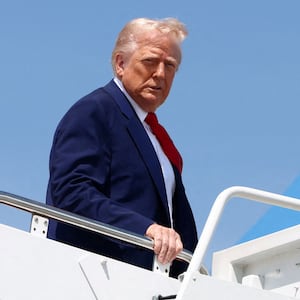 U.S. President Donald Trump boards Air Force One as he departs for Michigan to attend a rally to celebrate his first 100 days in office, at Joint Base Andrews in Maryland, U.S., April 29, 2025. REUTERS/Evelyn Hockstein/File Photo