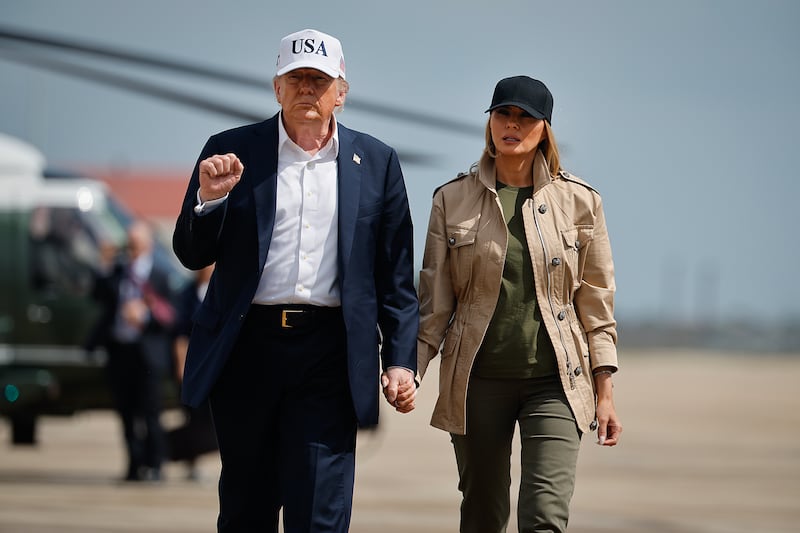 President Donald Trump, pictured with First Lady Melania on July 11, shared that he would tell the first lady about his "wonderful" call with Russian President Vladimir Putin and she would point out Russia was attacking Ukraine.
