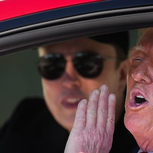 Donald Trump and White House Senior Advisor, Tesla and SpaceX CEO Elon Musk sit in a Tesla Model S on the South Lawn of the White House.
