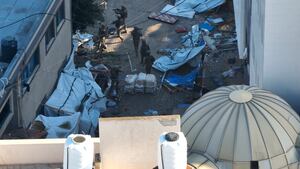 Israeli soldiers walk at the Al Shifa hospital complex, amid their ground operation against Palestinian Islamist group Hamas, in this still image from handout video obtained November 15, 2023.