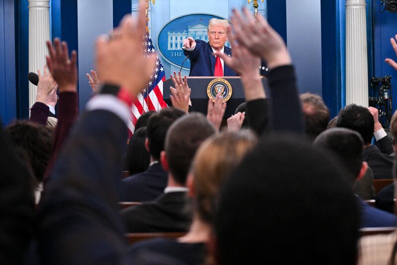 Donald Trump takes questions from the press.