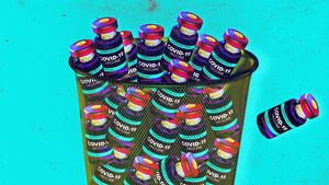 Covid vaccine vials in a garbage can photo illustration
