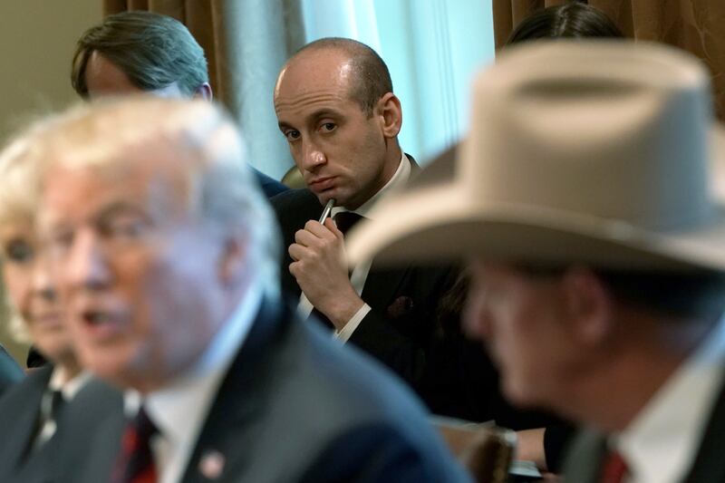 WASHINGTON, DC - JANUARY 11:  U.S. President Donald Trump speaks as Senior Advisor to the President Stephen Miller (C) listens during a round-table discussion on border security and safe communities with State, local, and community leaders in the Cabinet Room of the White House on January 11, 2019 in Washington, DC. As the second-longest government shut down continues, Democrats and Republicans have not found a compromise for border security funding and President Donald Trump's proposed wall on the U.S.-Mexico border.   (Photo by Alex Wong/Getty Images)