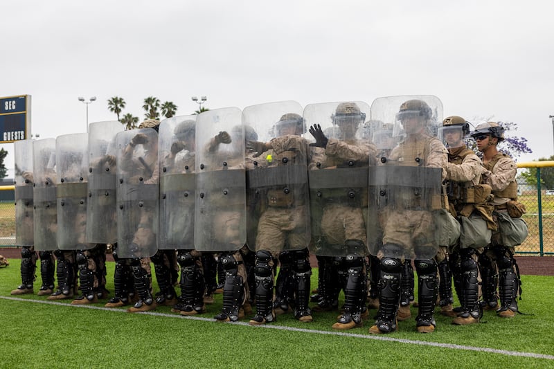 U.S. Marines with 2nd Battalion, 7th Marine Regiment, 1st Marine Division, rehearse crowd control tactics at a base in the greater Los Angeles area after being placed in an alert status over the weekend.