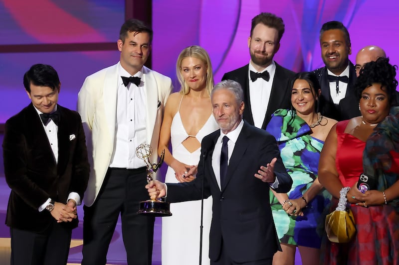 LOS ANGELES, CALIFORNIA - SEPTEMBER 15: Jon Stewart (C), cast, and crew accept the Outstanding Talk Series award for "The Daily Show " onstage during the 76th Primetime Emmy Awards at Peacock Theater on September 15, 2024 in Los Angeles, California. (Photo by Leon Bennett/WireImage)