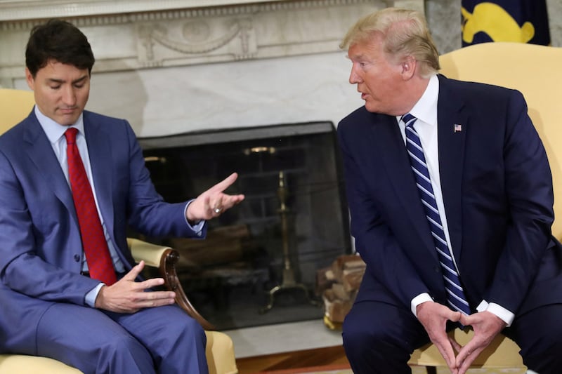 FILE PHOTO: U.S. President Donald Trump listens while meeting with Canada's Prime Minister Justin Trudeau in the Oval Office of the White House in Washington, U.S., June 20, 2019. REUTERS/Jonathan Ernst/File Photo