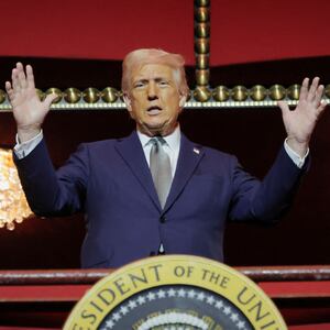 U.S. President Donald Trump gestures while he poses for a picture at the presidential box at the Kennedy Center, in Washington, D.C., U.S., March 17, 2025. REUTERS/Carlos Barria