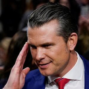 Pete Hegseth salutes.