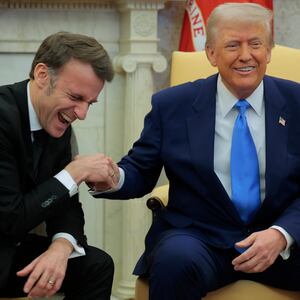 Donald Trump and Emmanuel Macron shake hands