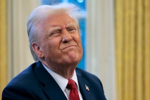 President Donald Trump reacts to a reporter's question from the Resolute Desk after signing an executive order to appoint the deputy administrator of the Federal Aviation Administration in the Oval Office at the White House on January 30, 2025 in Washington, DC.
