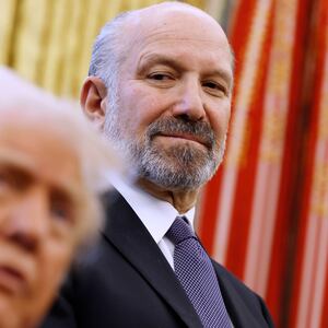 President Donald Trump, alongside Howard Lutnick, his nominee for Commerce Secretary, speaks to reporters in the Oval Office of the White House on February 03, 2025 in Washington, DC.