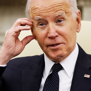 Joe Biden scratches his head in an interview.