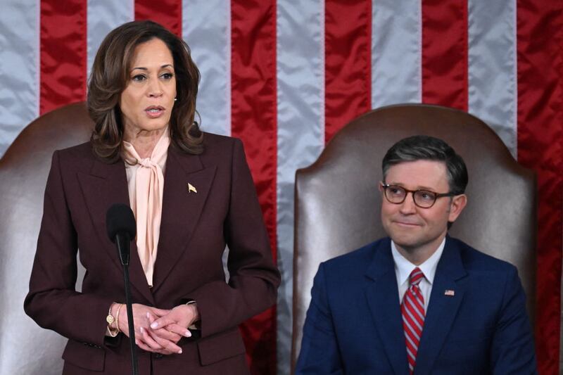 Then-Vice President Kamala Harris certifies Donald Trump’s electoral victory while House Speaker Mike Johnson looks on.