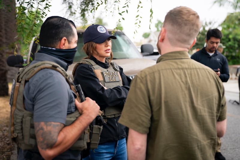 Homeland Security Secretary Kristi Noem has accompanied ICE agents on numerous raids this year. Oftentimes, she is the only official who is not concealing their identity with a neck gaiter or mask.