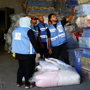UNRWA workers sort aid to be delivered to Gazans.