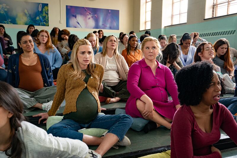Brianne Howey and Amy Schumer.