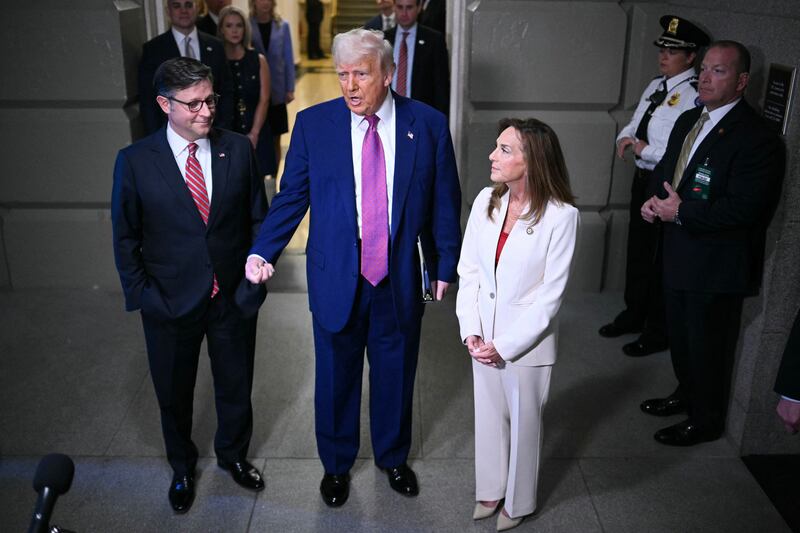 President Donald Trump speaks to reporters as he arrives for a House Republican meeting at the U.S. Capitol on May 20, 2025.
