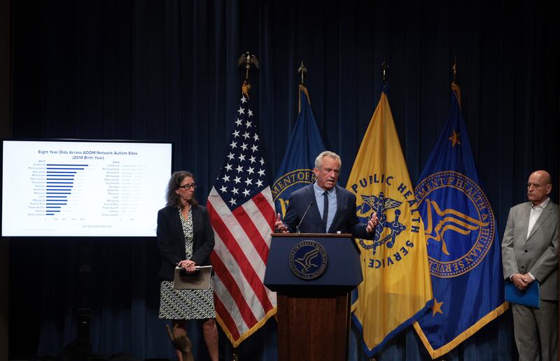U.S. Secretary of Health and Human Services Robert F. Kennedy Jr. (2nd R) speaks as Associate Professor at Rutgers NJMS and Director of New Jersey Autism Study Walter Zahorodny (R) listens during a news conference at the Department of Health and Human Services on April 16, 2025 in Washington, DC. Secretary Kennedy held a news conference to discuss the recent surge of autism cases.