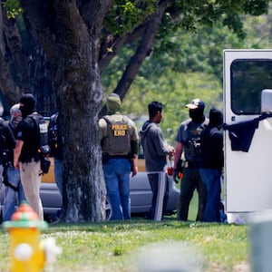 Federal agents are seen near Glenn Valley Foods in Omaha, Neb., Tuesday, June 10, 2025. (Nikos Frazier/Omaha World-Herald via AP)