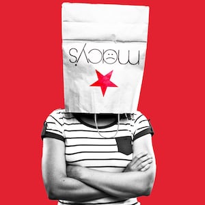 Woman with crossed arms with a Macy's shopping bag on her head