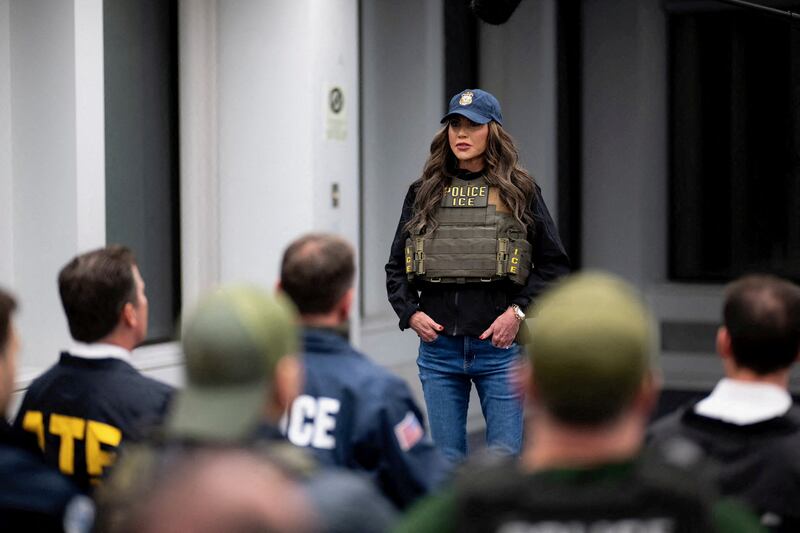 U.S. Department of Homeland Security Secretary Kristi Noem wears an ICE vest during a briefing with law enforcement agents ahead of immigration raids in New York City.