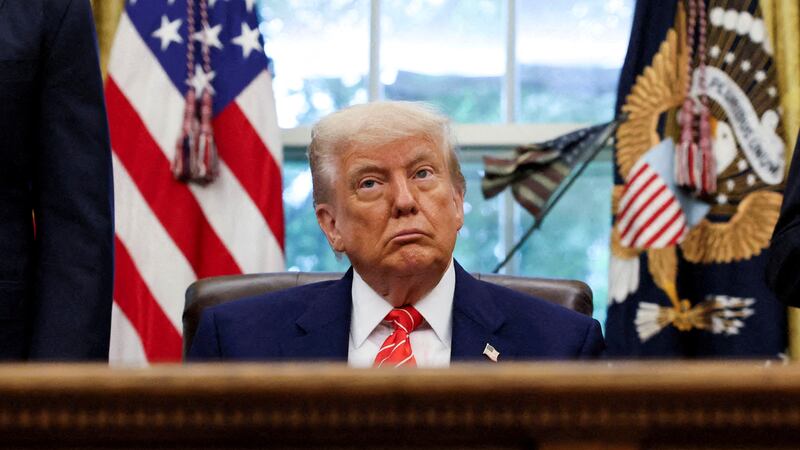President Donald Trump makes an announcement about a trade deal with the U.K in the Oval Office on May 8, 2025.