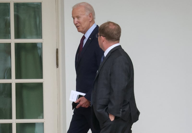 President Joe Biden walking with his physician, Dr. Kevin O'Connor, towards the Oval Office at the White House on August 28, 2023.