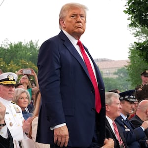 President Donald Trump stands during the celebration of the Army's 250th birthday on the National Mall on June 14, 2025 in Washington, DC. The U.S. Army is marking its 250th anniversary with a military parade along Constitution Avenue that includes roughly 6,600 troops, 150 vehicles, and over 50 aircraft.  The parade, which coincides with President Donald Trump's 79th birthday, is designed to tell the history of the Army.