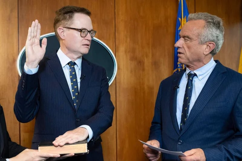 Robert F. Kennedy, Jr. conducts the swearing-in ceremony of Jim O'Neill as his deputy secretary in June 9.