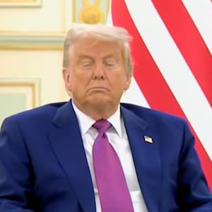 Donald Trump sits with eyes closed during an official visit to Saudi Arabia.