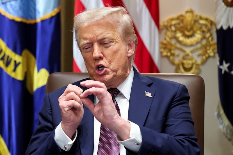 U.S. President Donald Trump gestures during a cabinet meeting at the White House in Washington, D.C., U.S., August 26, 2025.