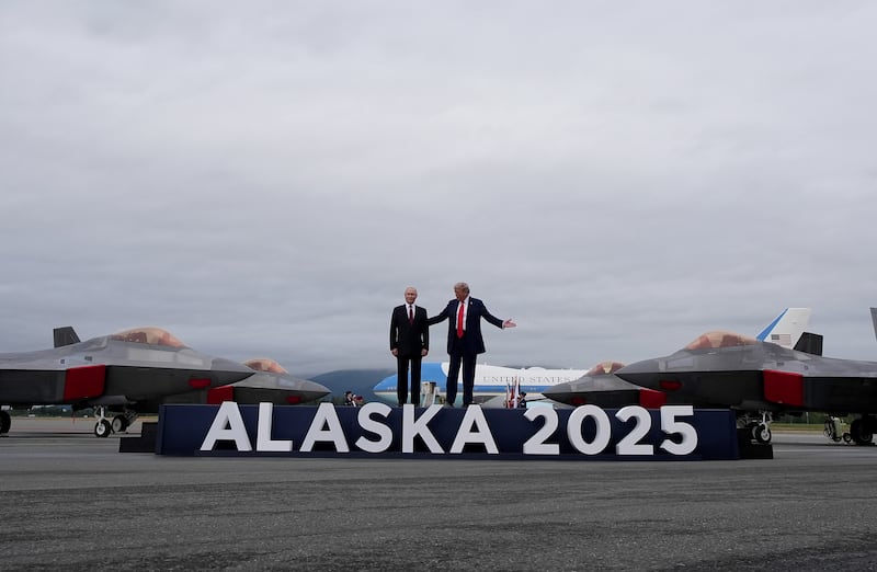 President Donald Trump welcomes Russian President Vladimir Putin at Joint Base Elmendorf-Richardson in Anchorage, Alaska with four F-22s on display on August 15, 2025.