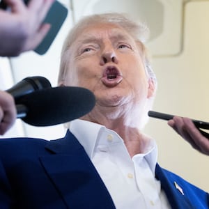 US President Donald Trump speaks to reporters about the Israel-Iran conflict, aboard Air Force One on June 24, 2025, while traveling to attend the NATO's Heads of State and Government summit in The Hague in the Netherlands. (Photo by Brendan Smialowski / AFP) (Photo by BRENDAN SMIALOWSKI/AFP via Getty Images)