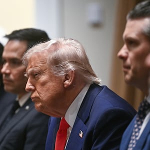 US President Donald Trump (C) looks on during a cabinet meeting in the Cabinet Room of the White House.